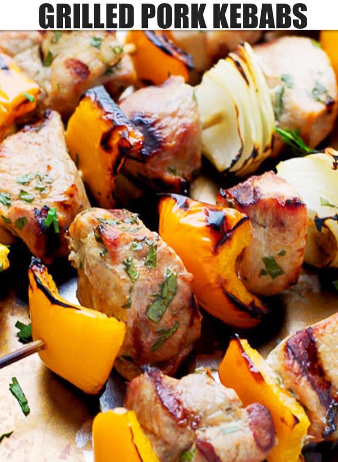 GRILLED PORK KEBABS WITH ONION AND PEPPER ON A BAKING TRAY