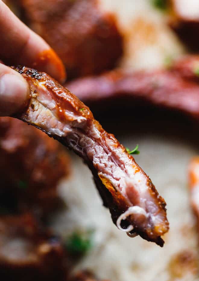 Tender juicy smoked ribs and bite taken into