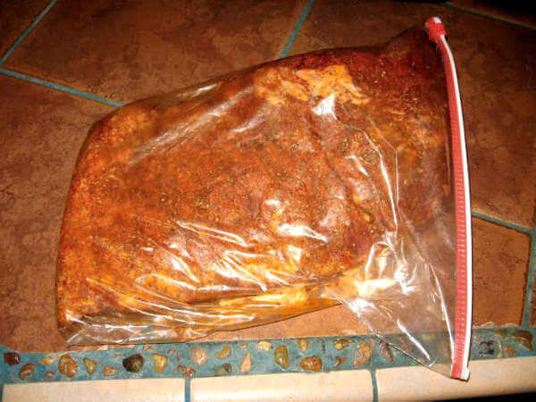 A Rubbed Brisket In a Gallon Food Storage Bag, Resting To Allow Flavors to Permeate The Meat