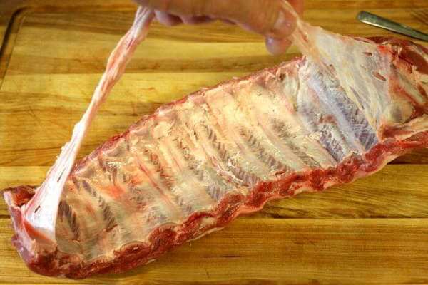 Removing The Fell, or Membrane, From The Bony Side of a Slab of Ribs